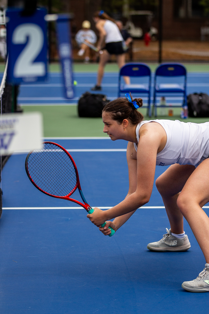A tennis player prepares for a set.